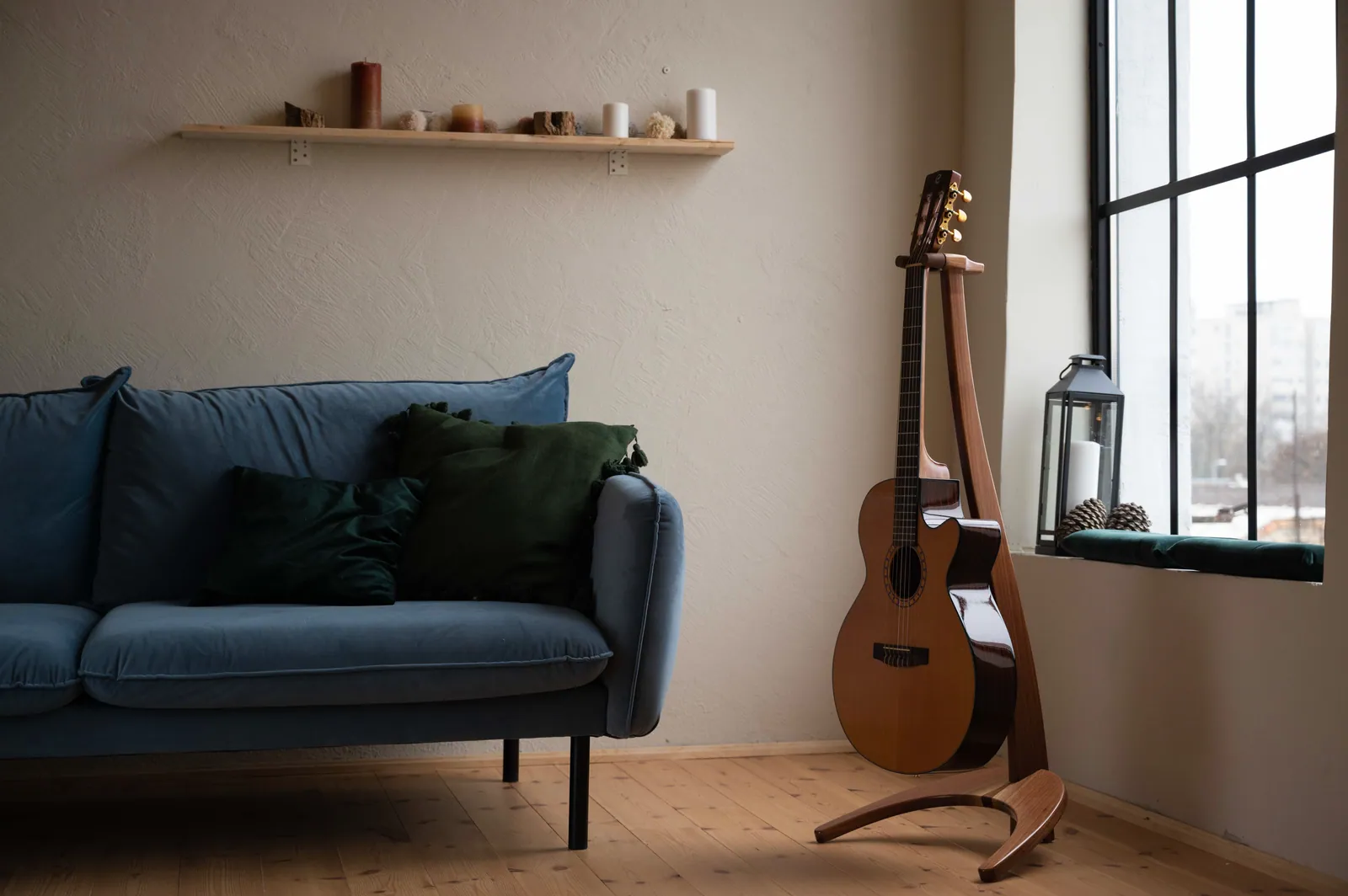 FormaStand by a blue sofa